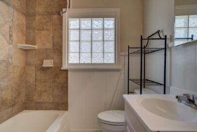 2320 26th Street Lubbock, TX 79411 - Photo 11 of 17 a bathroom with a sink toilet and shower