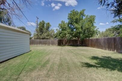2320 26th Street Lubbock, TX 79411 - Photo 14 of 17 a backyard of a house with lots of green space