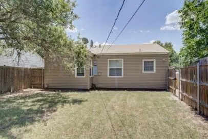 a view of a house with a small yard