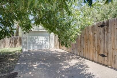 2320 26th Street Lubbock, TX 79411 - Photo 17 of 17 a front view of a house with a garden