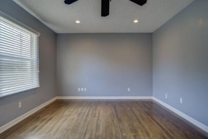 2320 26th Street Lubbock, TX 79411 - Photo 4 of 17 a view of room with window and wooden floor