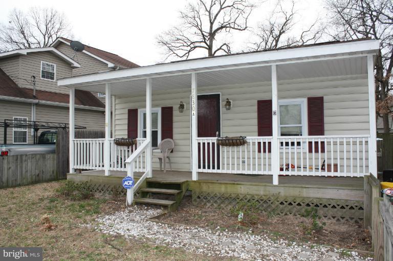 7830 A East Shore Road Pasadena, MD 21122 - Photo 6 of 6 front view of a house with a porch