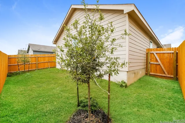 a front view of house with garden