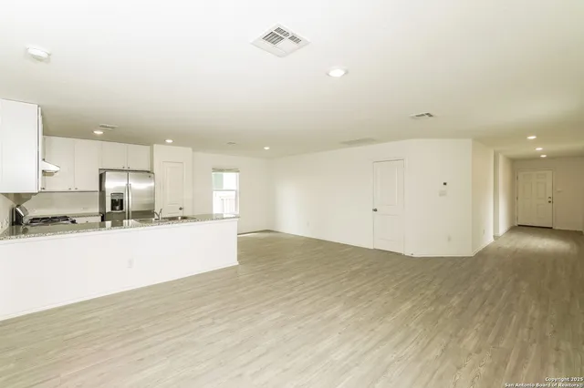 a view of kitchen with wooden floor
