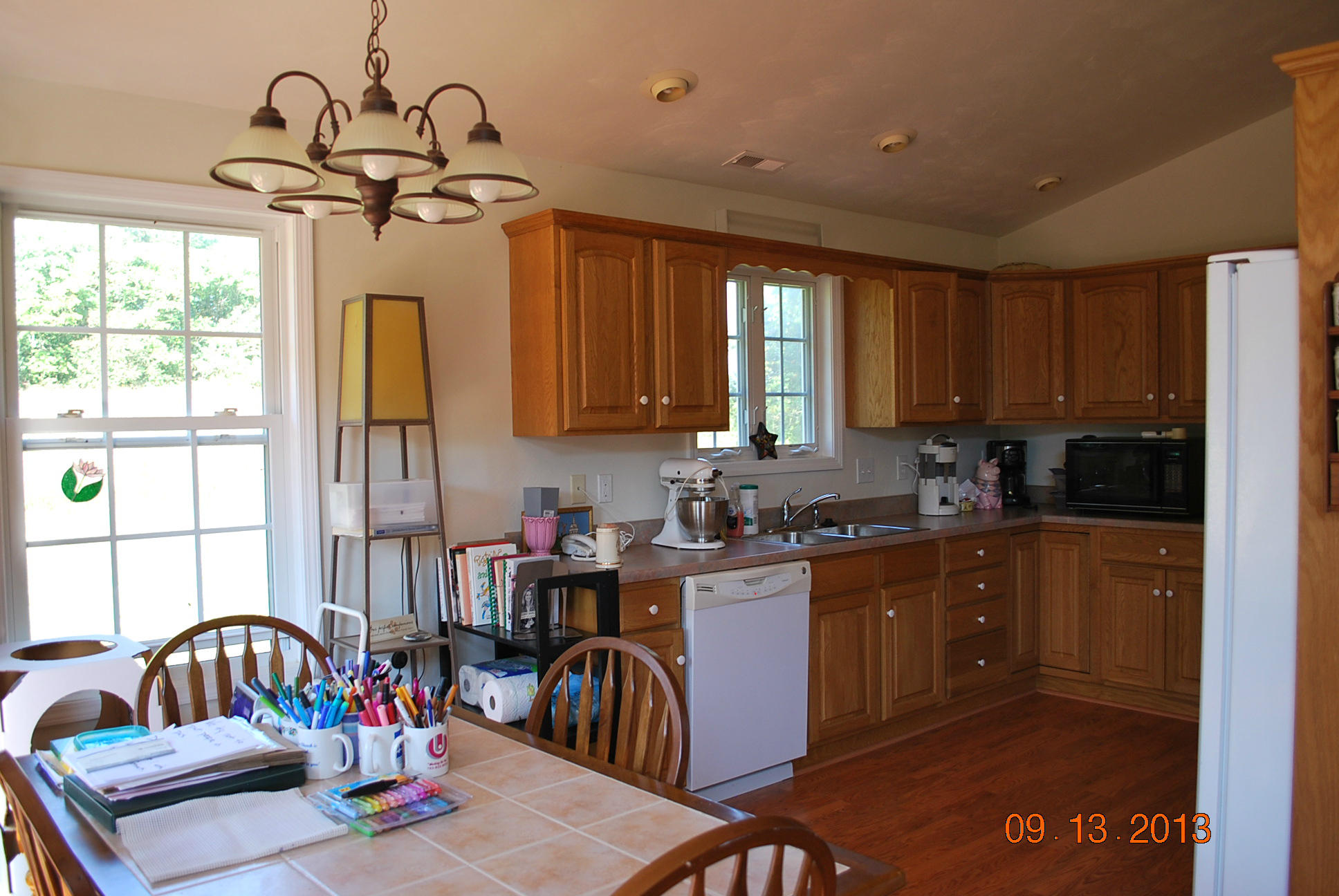 2777 Highland Road Roanoke, VA 24014 - Photo 11 of 56 a kitchen with sink refrigerator dining table and chairs