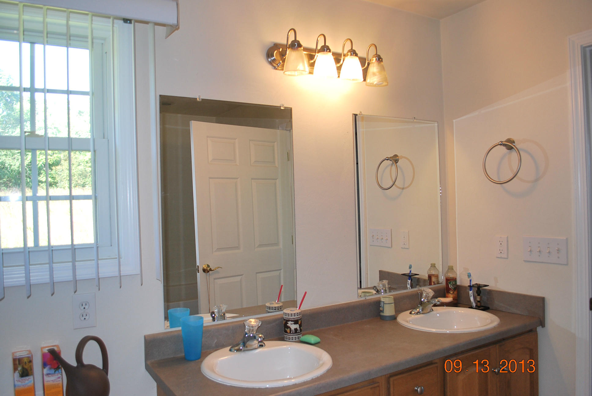 2777 Highland Road Roanoke, VA 24014 - Photo 21 of 56 a bathroom with a double vanity sink and a mirror