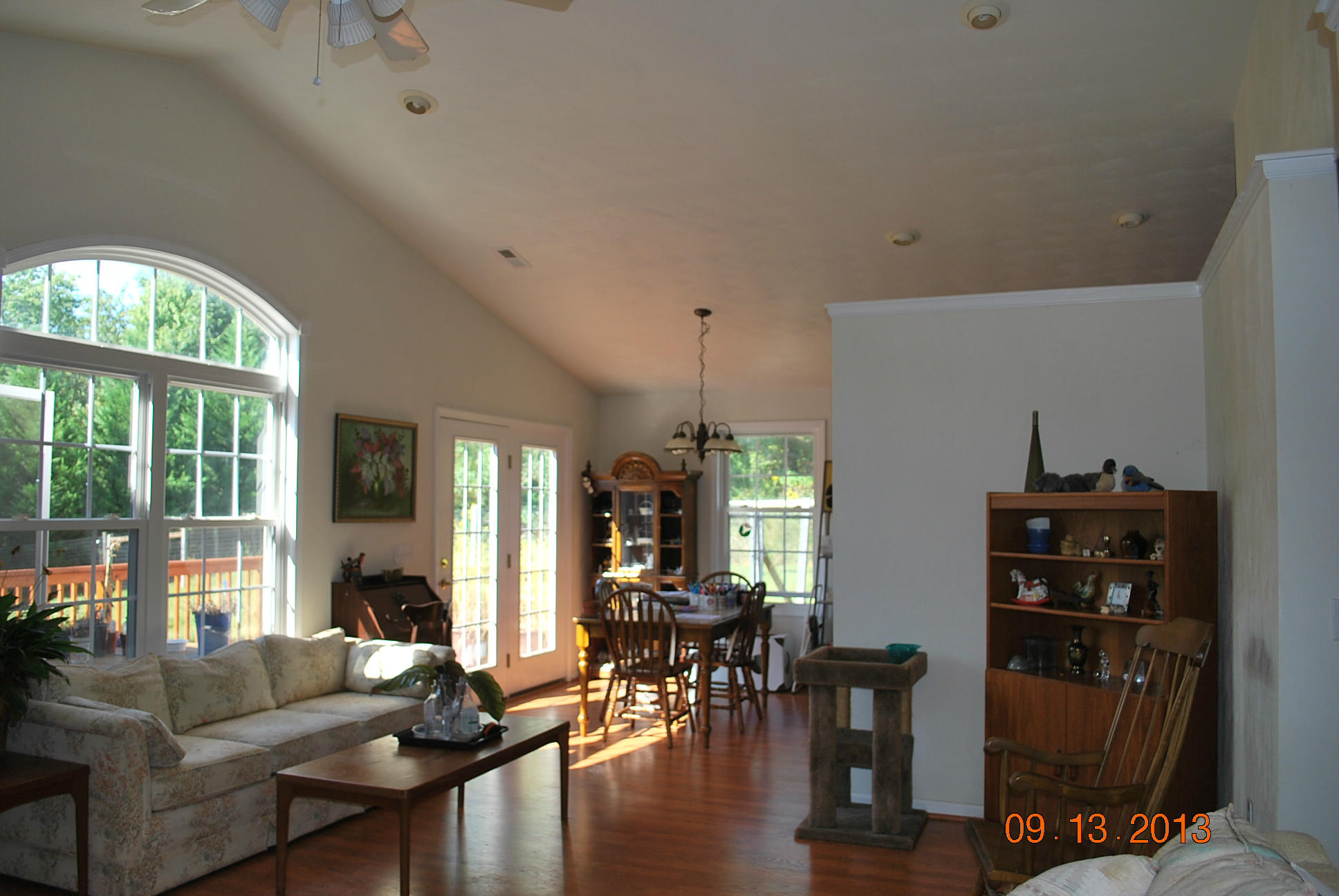 2777 Highland Road Roanoke, VA 24014 - Photo 4 of 56 a living room with furniture a wooden floor and a large window