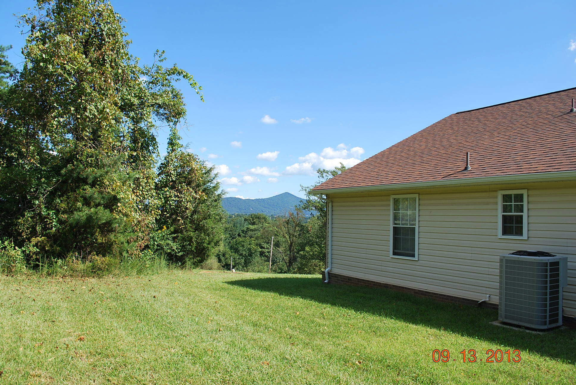 2777 Highland Road Roanoke, VA 24014 - Photo 44 of 56 a view of a backyard with plants and large tree