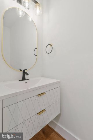 a bathroom with a sink and vanity