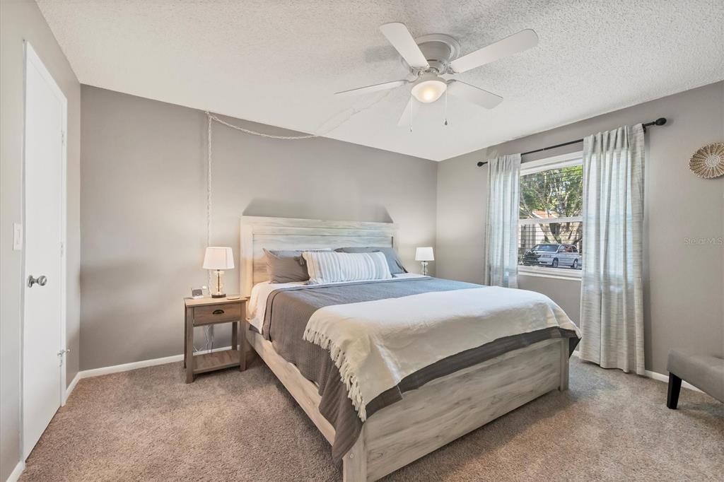 3239 South Beneva Road, Unit 101 Sarasota, FL 34232 - Photo 16 of 37 a bedroom with a bed and window