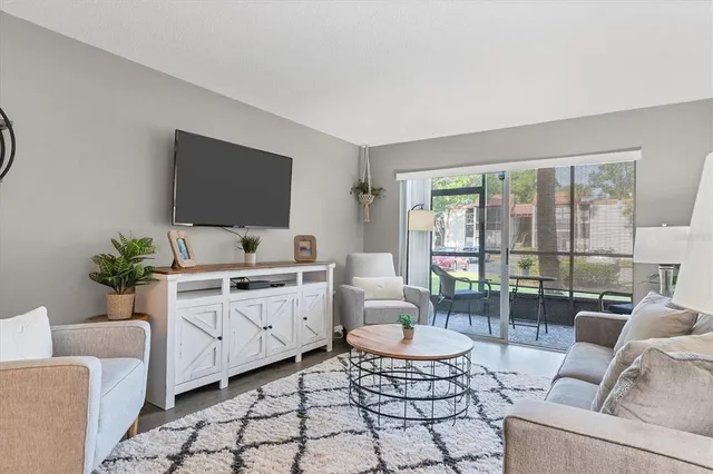 a living room with furniture and a large window