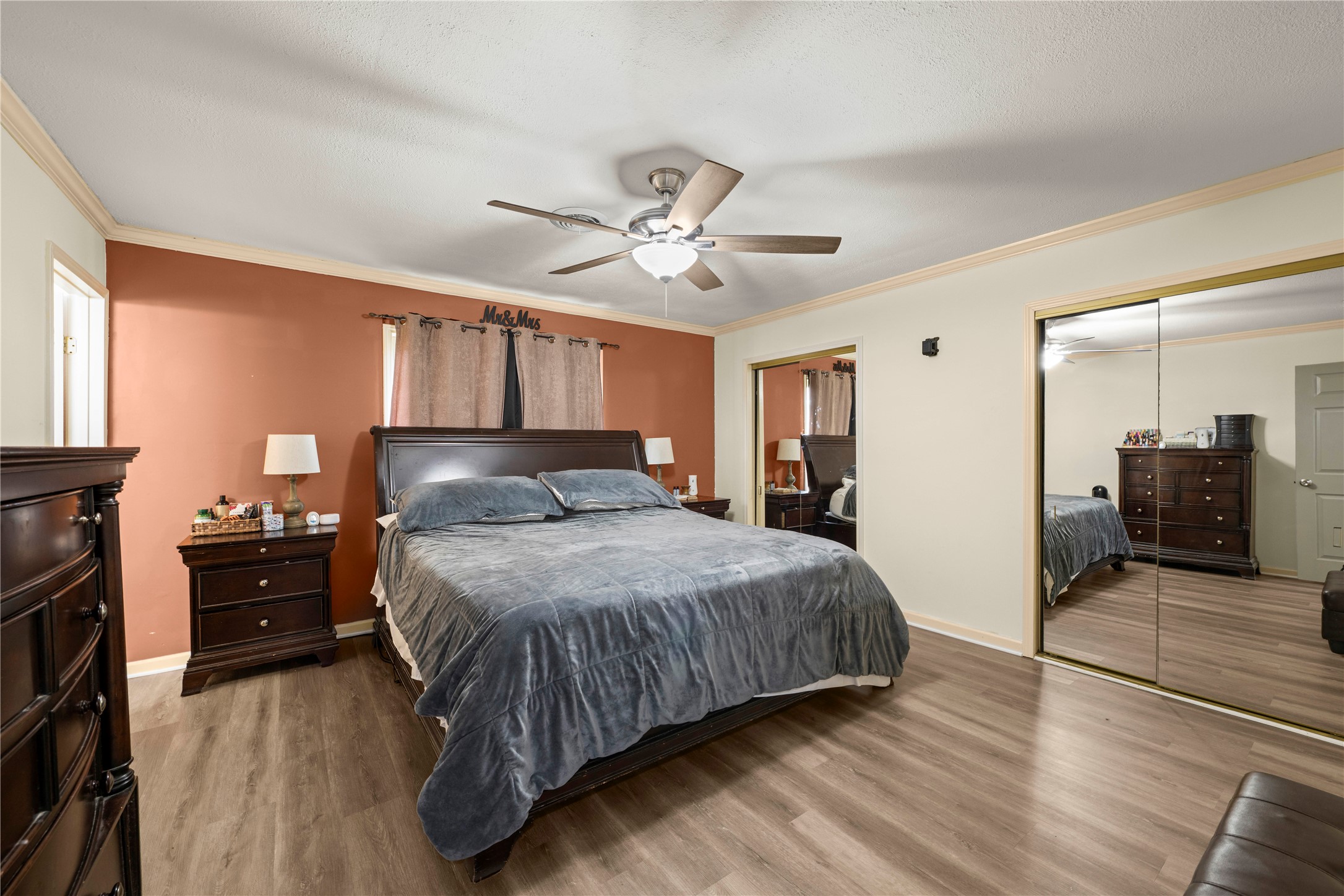 2915 County Road 153 Georgetown, TX 78626 - Photo 17 of 24 a bedroom with a bed and a chandelier