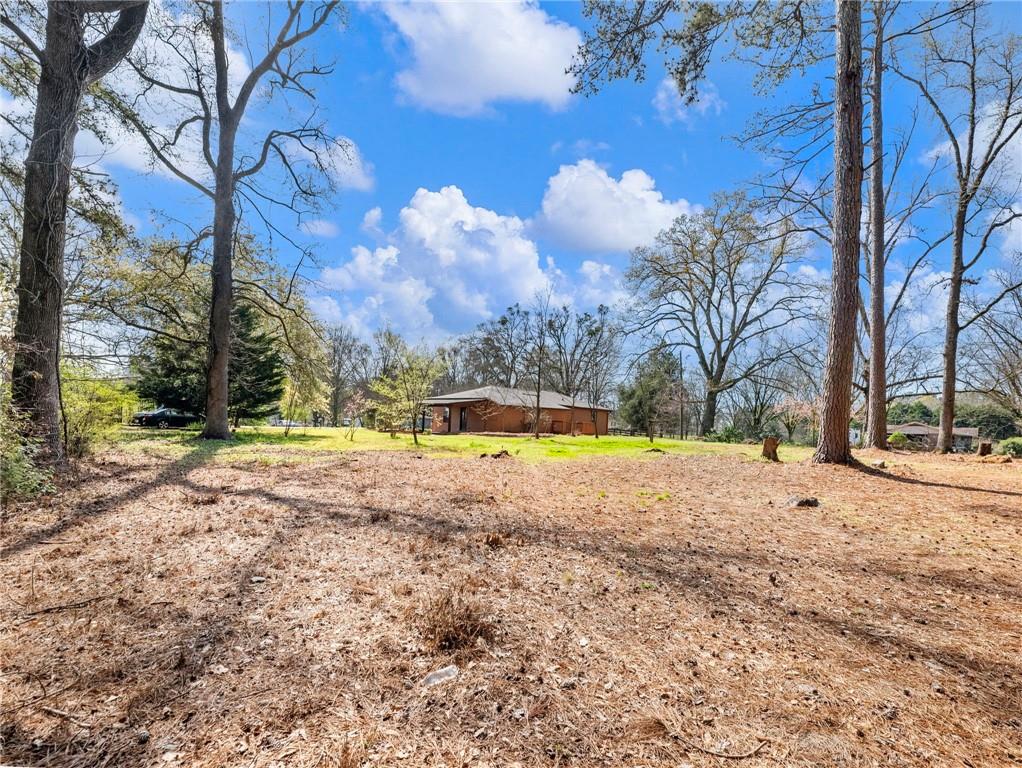 1686 Shoal Creek Road Monroe, GA 30656 - Photo 40 of 50 a view of swimming pool with an outdoor space and seating area