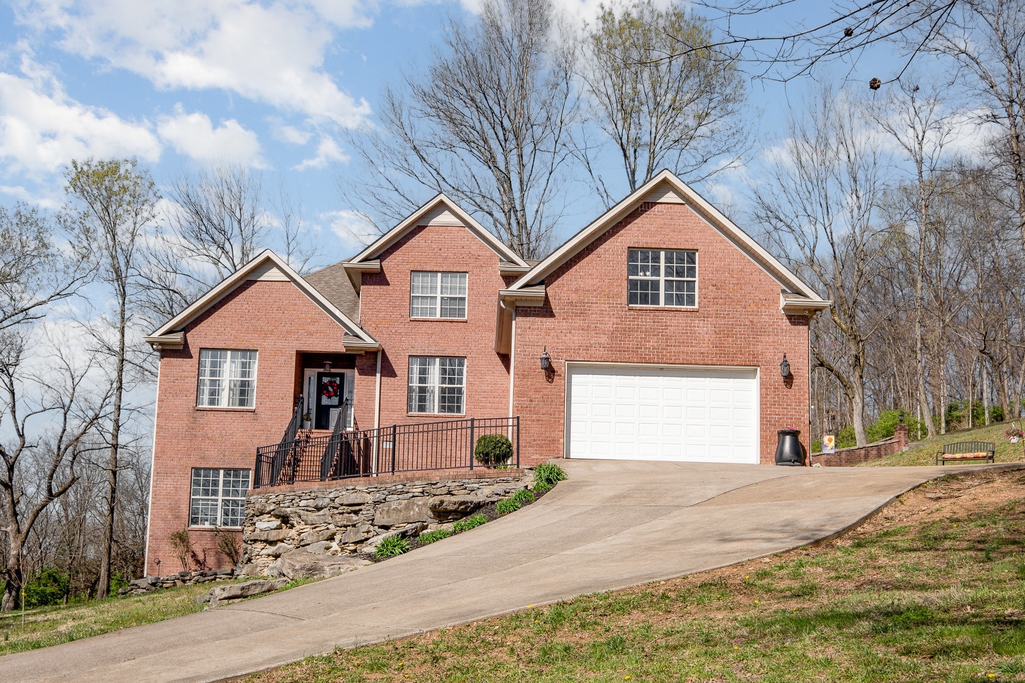 1604 Becca Lane Columbia, TN 38401 - Photo 12 of 54 a view of a white house with a yard covered with snow in front of it