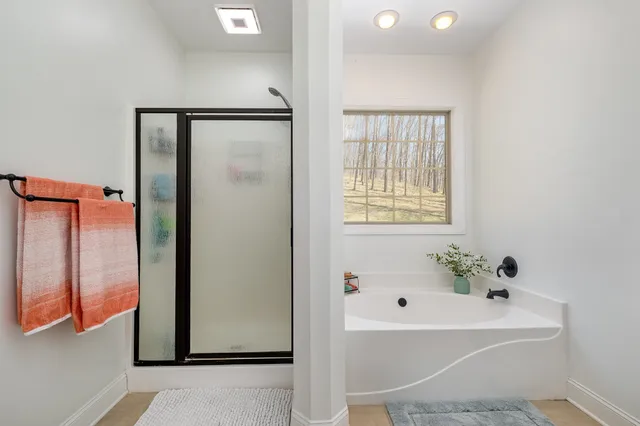 a white bath tub sitting next to a white sink