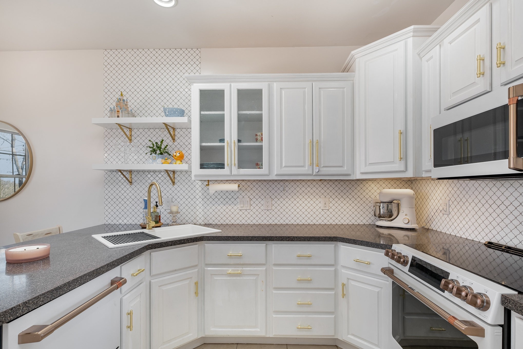 1604 Becca Lane Columbia, TN 38401 - Photo 35 of 54 a kitchen with stainless steel appliances granite countertop a sink a stove and white cabinets