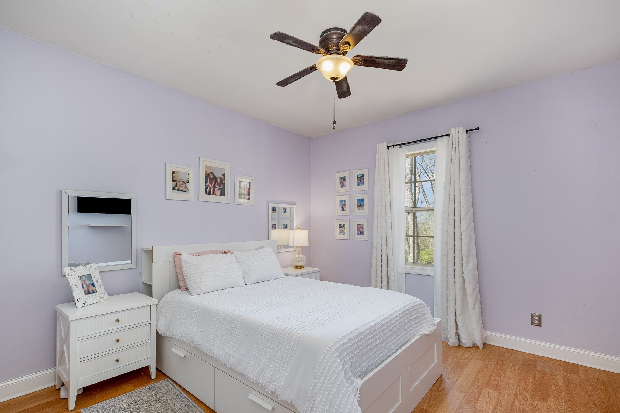 1604 Becca Lane Columbia, TN 38401 - Photo 41 of 54 a bedroom with a bed and a chandelier