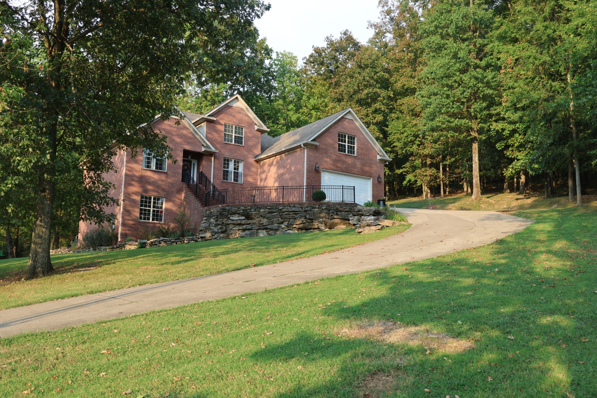 1604 Becca Lane Columbia, TN 38401 - Photo 54 of 54 a front view of a house with a yard and trees
