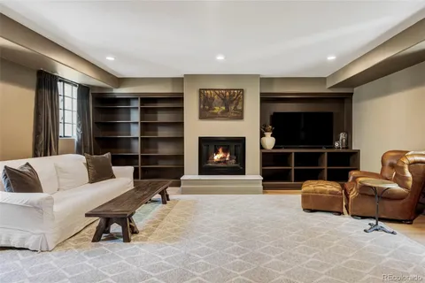 a view of a living room with furniture and a window