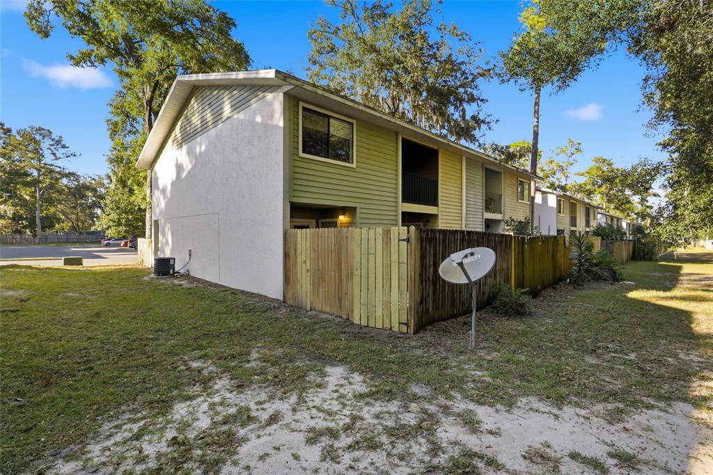 2219 Southwest 39th Way Gainesville, FL 32607 - Photo 17 of 17 a view of a house with backyard and garden