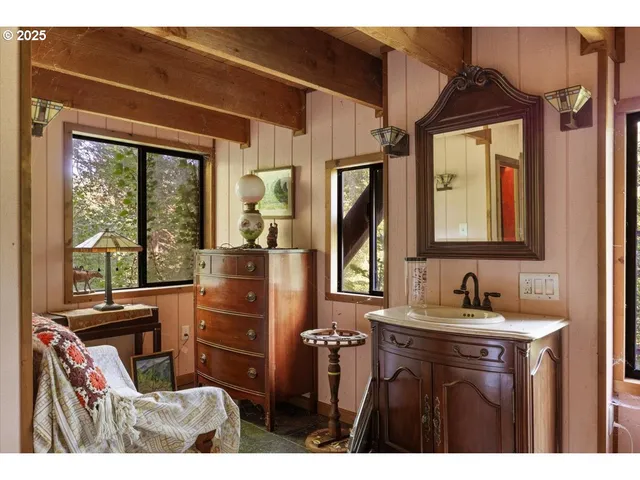 a bathroom with a sink a mirror and a window