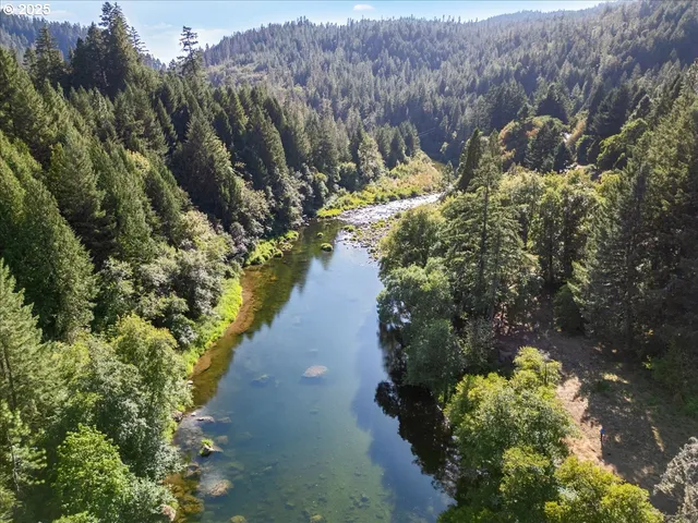 a view of a lake with a yard