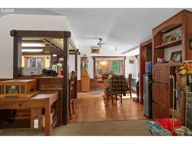 a view of a dining room with furniture and a wooden floor