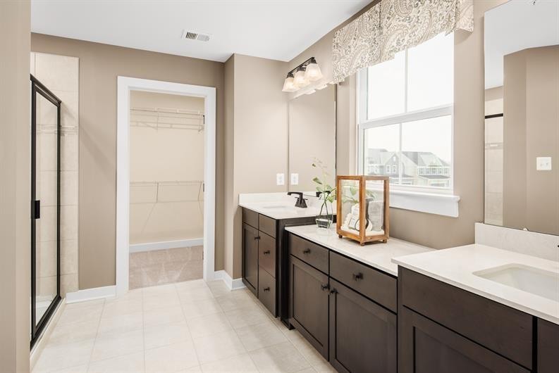 4003 Bluebell Lane Spring Hill, TN 37174 - Photo 16 of 40 a bathroom with a sink double vanity and a mirror