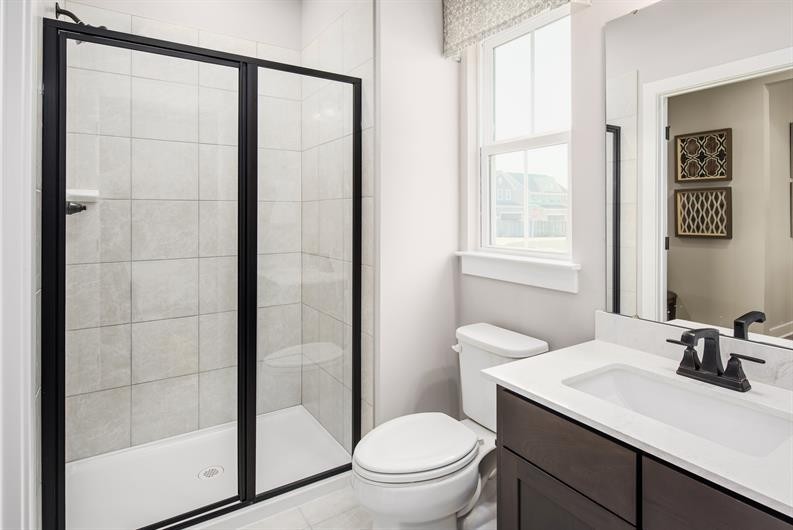 4003 Bluebell Lane Spring Hill, TN 37174 - Photo 10 of 40 a bathroom with a sink a toilet and shower