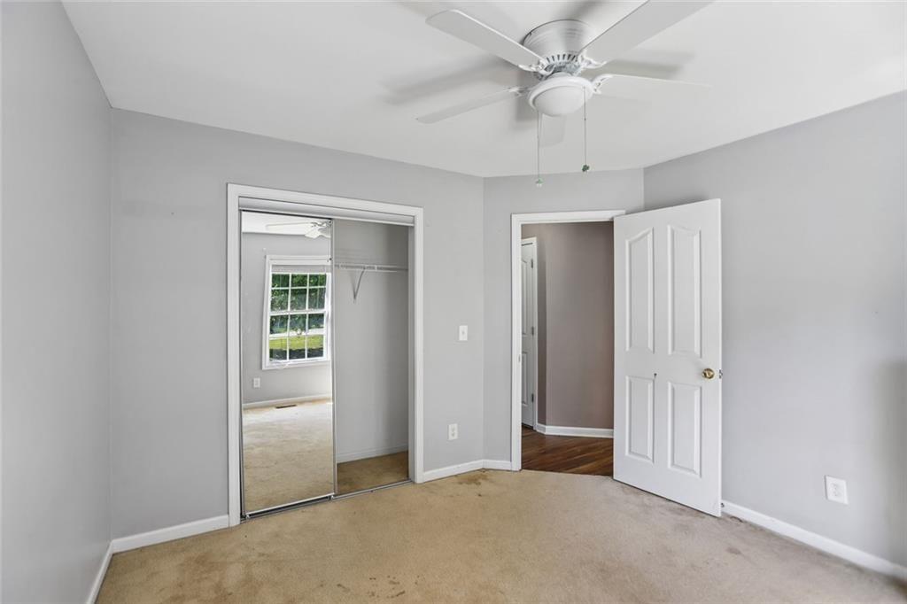 9720 Poole Road Villa Rica, GA 30180 - Photo 22 of 40 an empty room with fan and a ceiling fan
