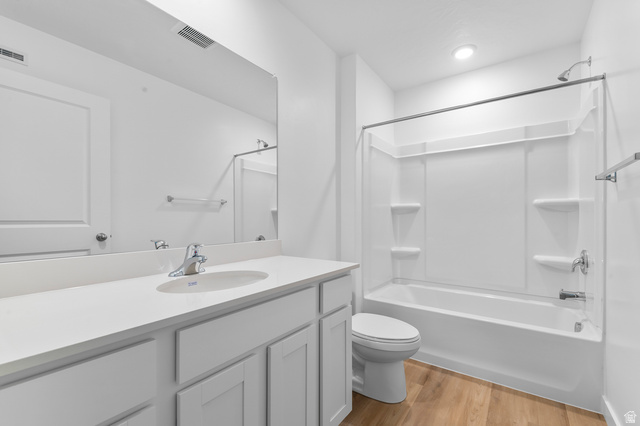1907 East 640th North, Unit 1225 Salem, UT 84653 - Photo 7 of 20 Bright bathroom featuring a single vanity with a solid surface countertop, an undermount sink, and chrome fixtures