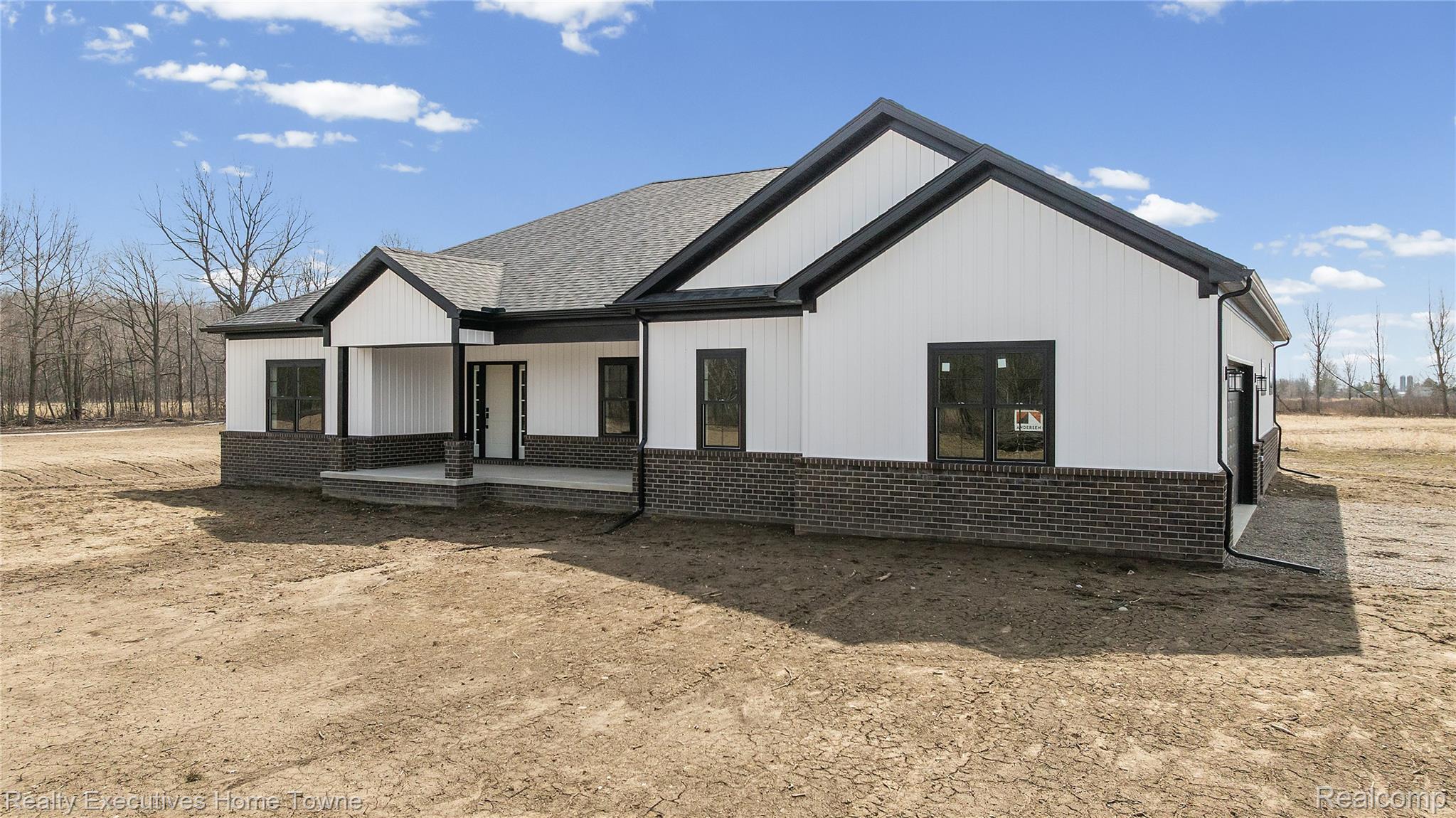 26850 Irwin Road Richmond, MI 48062 - Photo 29 of 47 Rear view of property featuring brick siding and covered porch