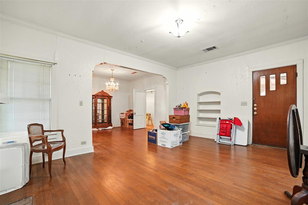 514 South Main Street Lockhart, TX 78644 - Photo 8 of 14 a living room with furniture and a wooden floor