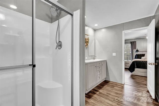 a bathroom with a shower and a sink