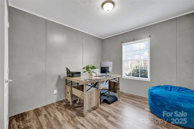 a workspace with furniture and a window