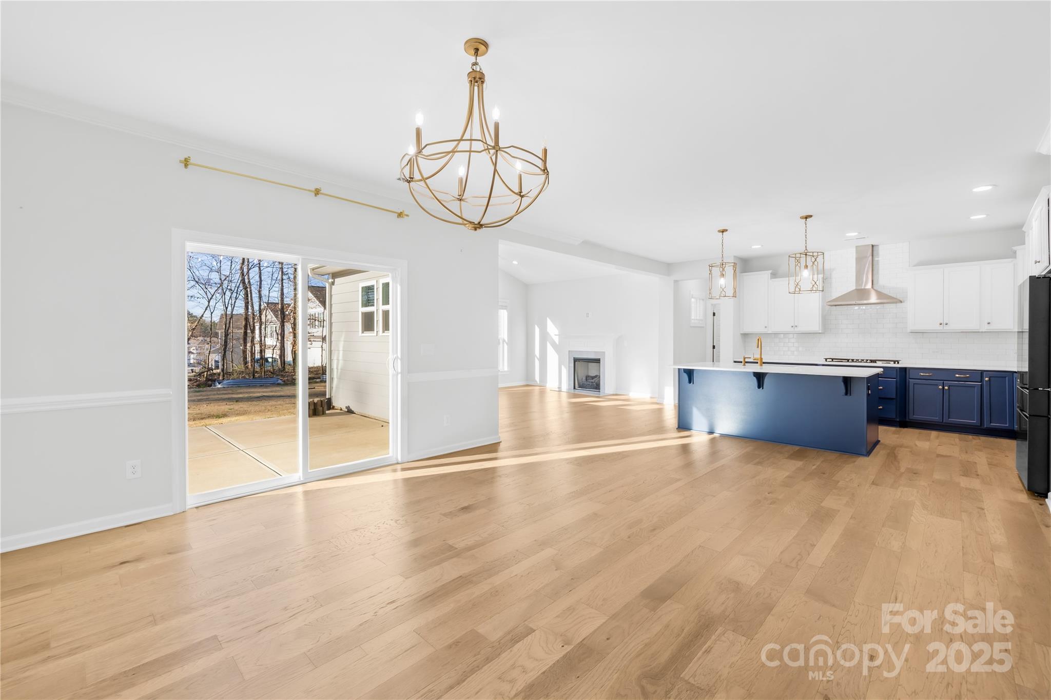 8005 Rolling Wheels Road Charlotte, NC 28215 - Photo 11 of 40 a view of a kitchen with a sink and wooden floor