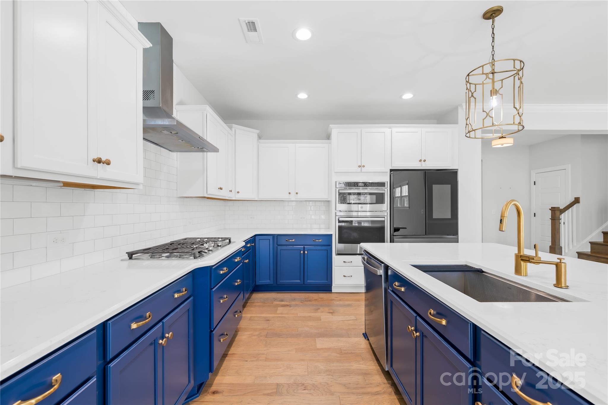 8005 Rolling Wheels Road Charlotte, NC 28215 - Photo 16 of 40 a kitchen with stainless steel appliances granite countertop a sink a stove and a refrigerator