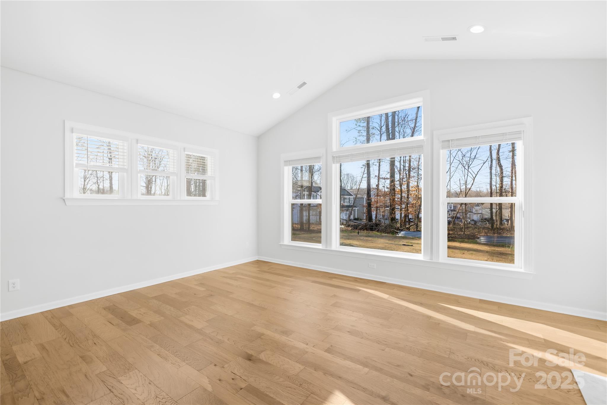 8005 Rolling Wheels Road Charlotte, NC 28215 - Photo 19 of 40 a view of an empty room with a window