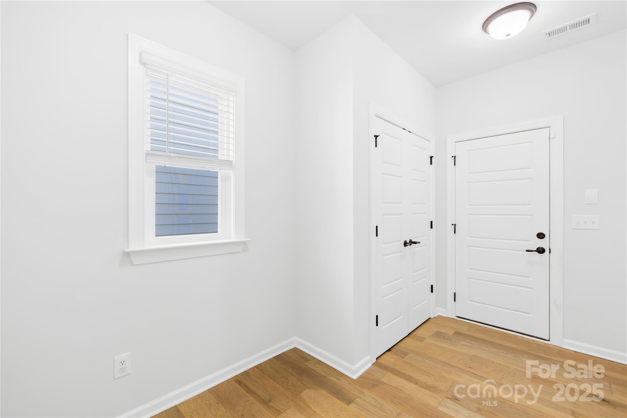 8005 Rolling Wheels Road Charlotte, NC 28215 - Photo 20 of 40 a view of a room with wooden floor and cabinet