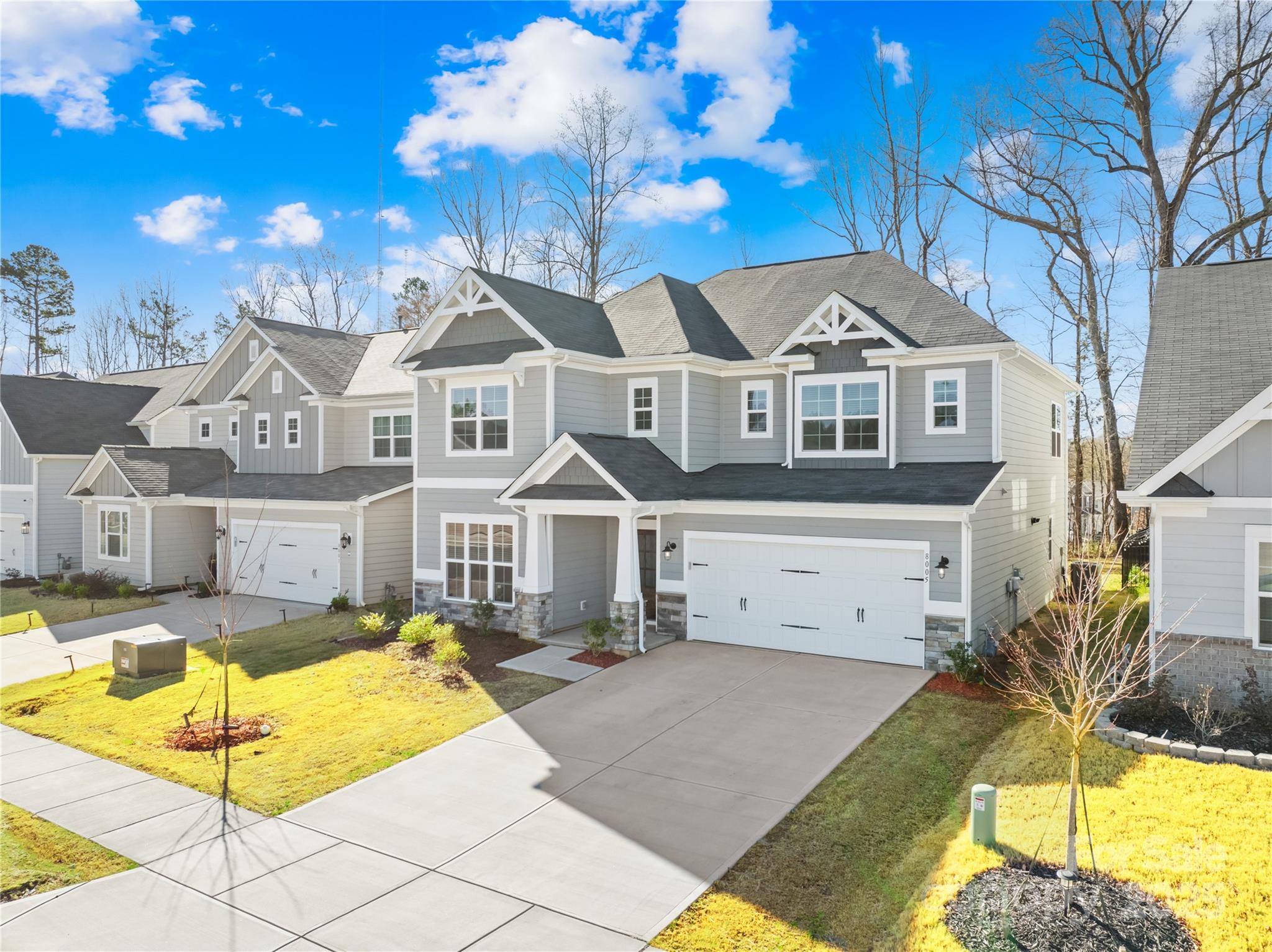 8005 Rolling Wheels Road Charlotte, NC 28215 - Photo 2 of 40 a front view of a house with a swimming pool