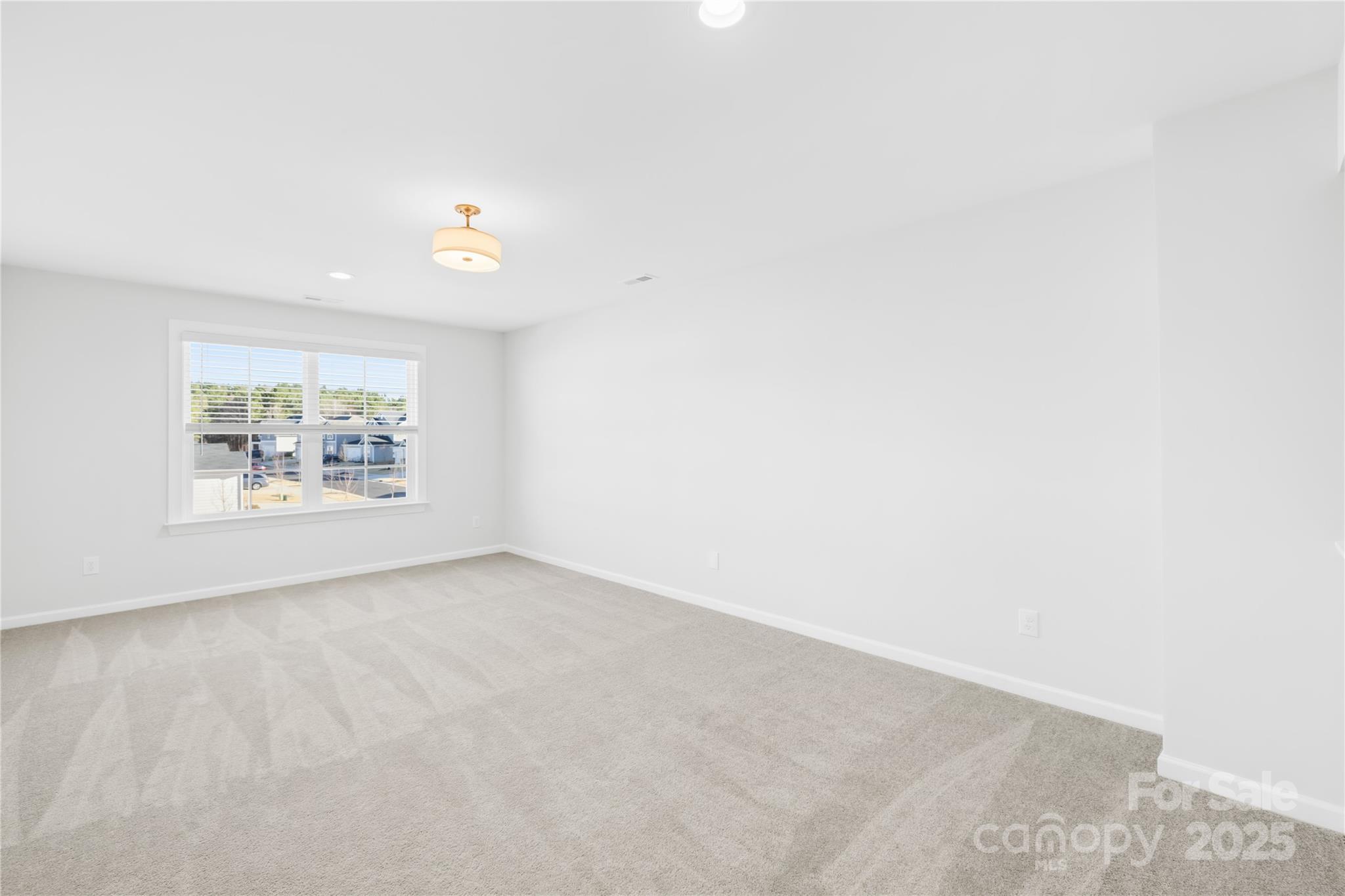 8005 Rolling Wheels Road Charlotte, NC 28215 - Photo 23 of 40 an empty room with a window