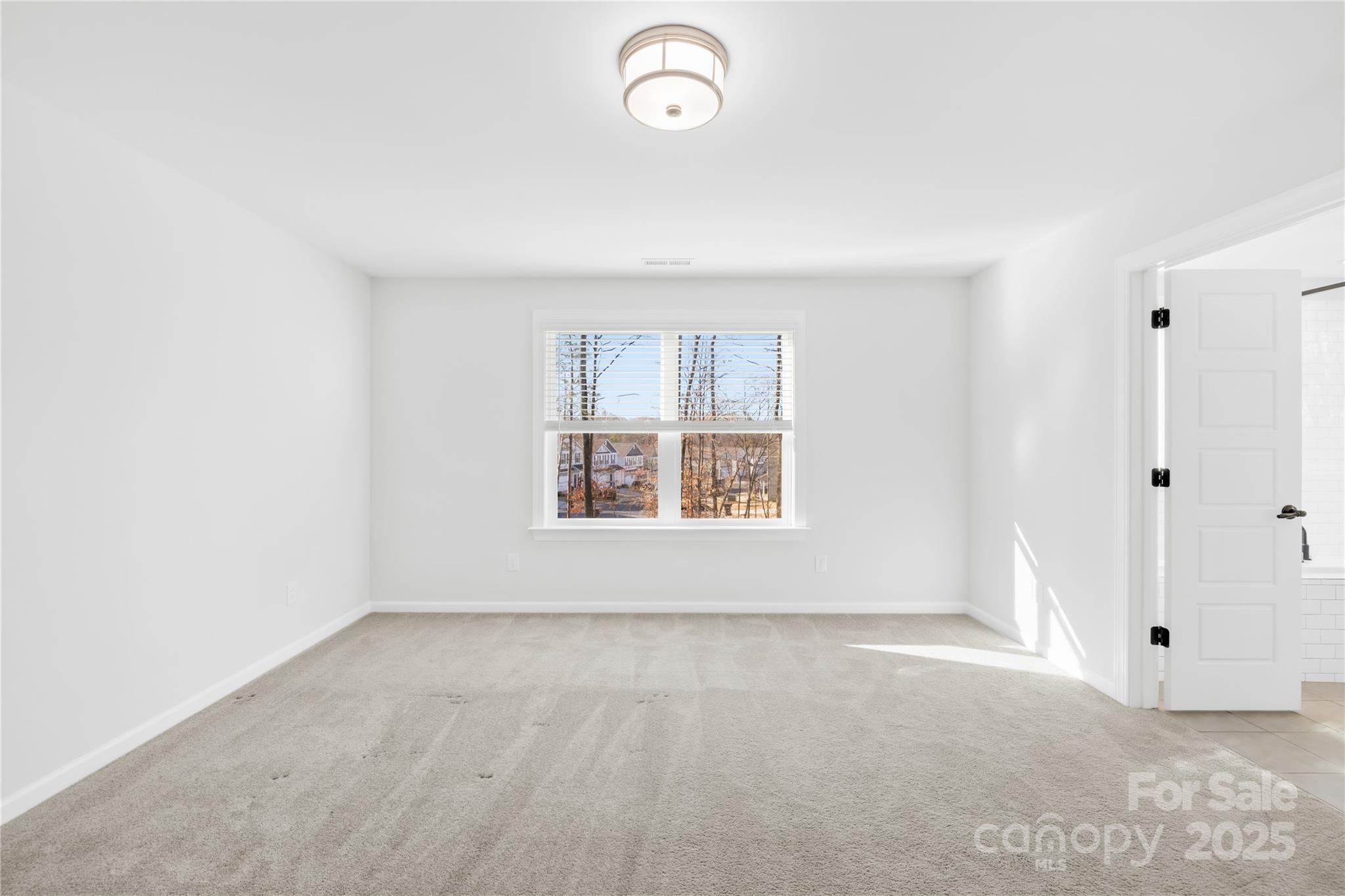 8005 Rolling Wheels Road Charlotte, NC 28215 - Photo 25 of 40 an empty room with a window