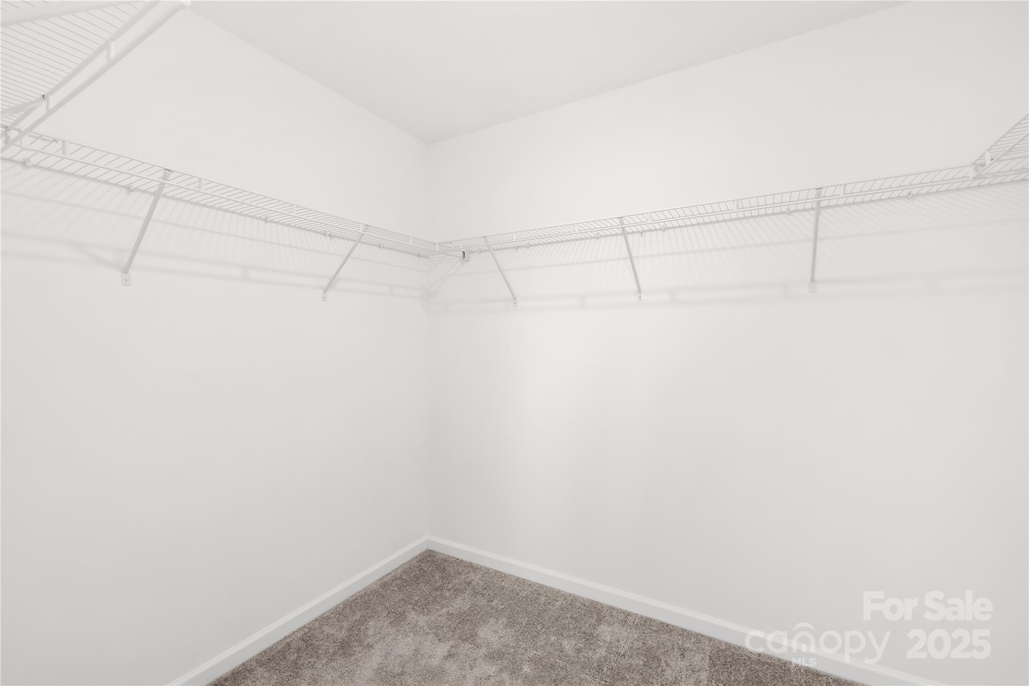 8005 Rolling Wheels Road Charlotte, NC 28215 - Photo 29 of 40 a view of a room with racks on the wall