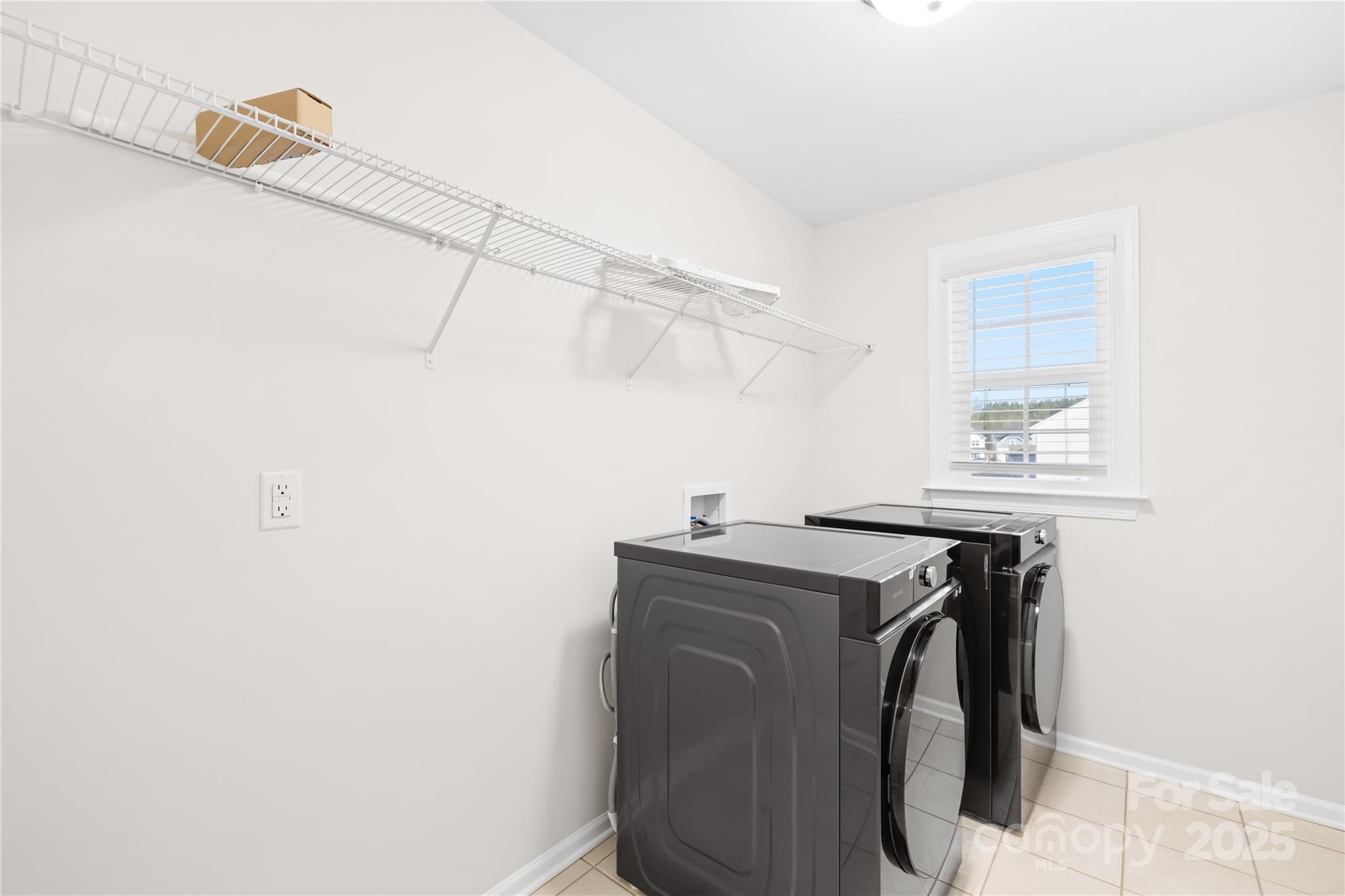 8005 Rolling Wheels Road Charlotte, NC 28215 - Photo 30 of 40 a utility room with dryer and washer