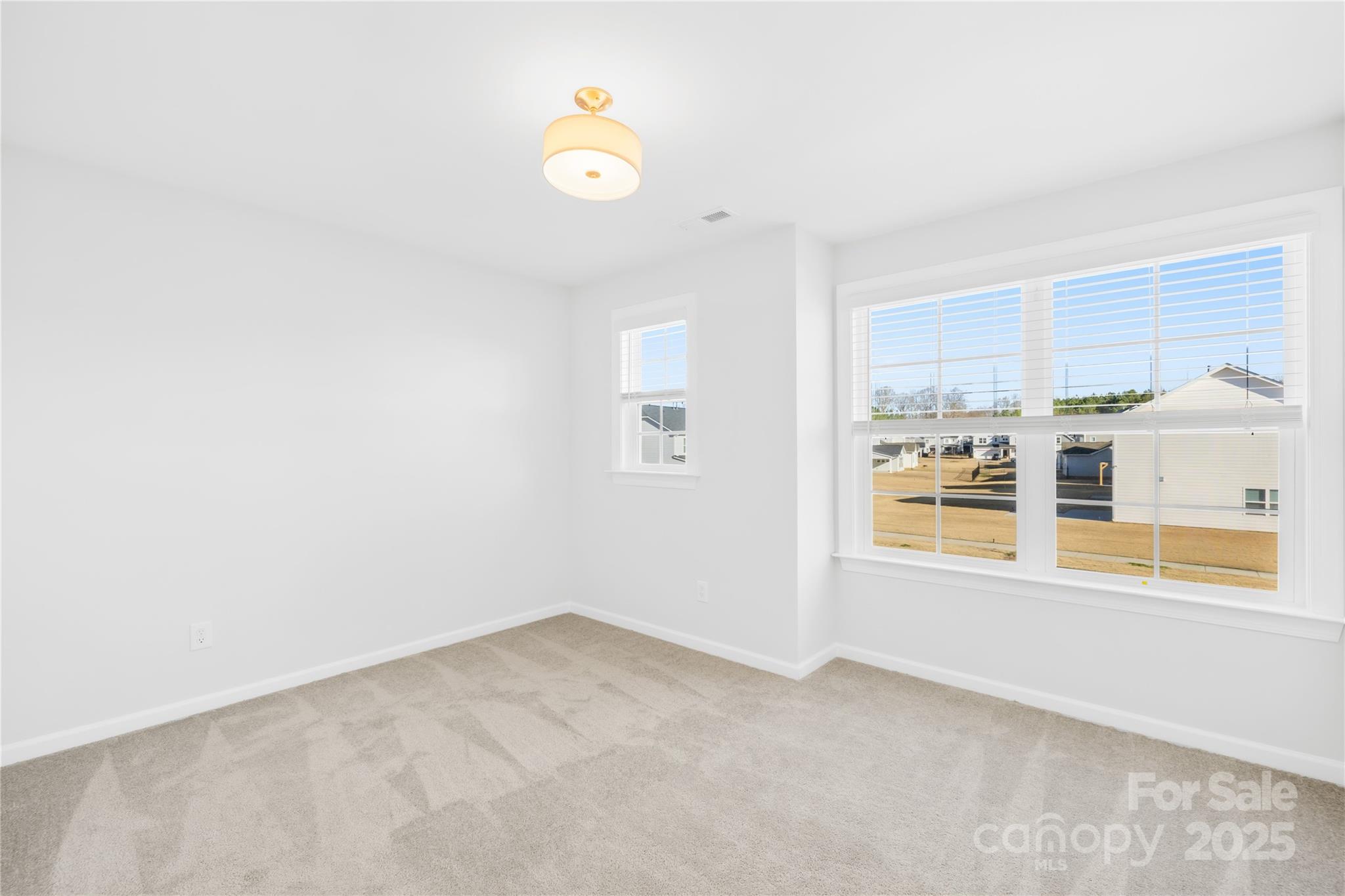 8005 Rolling Wheels Road Charlotte, NC 28215 - Photo 31 of 40 a view of an empty room with a window