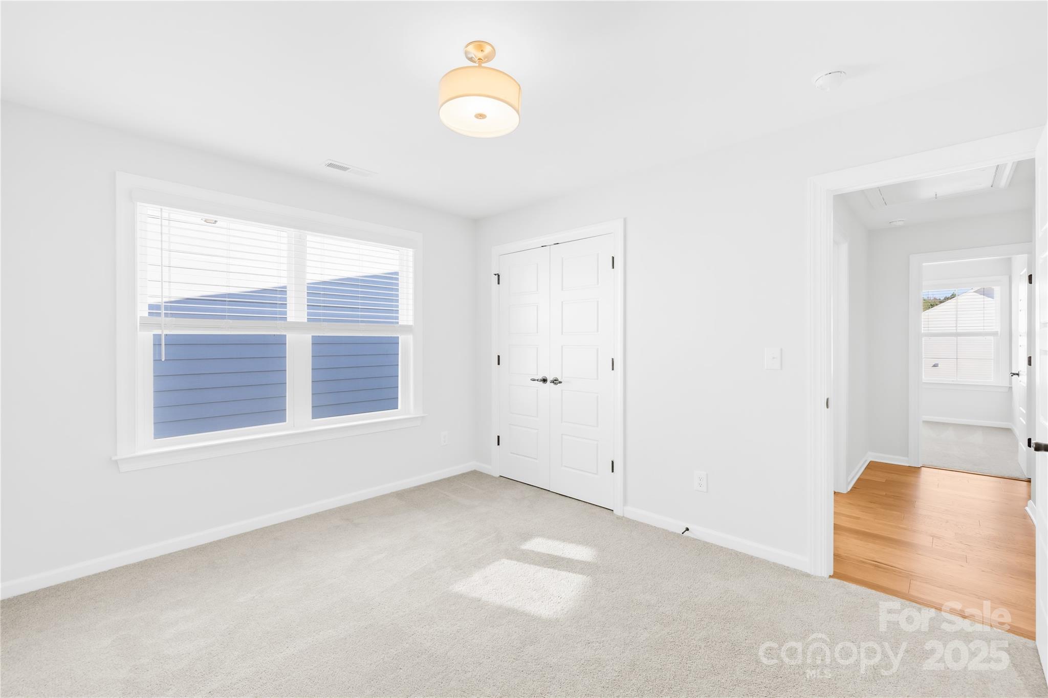 8005 Rolling Wheels Road Charlotte, NC 28215 - Photo 33 of 40 an empty room with a window