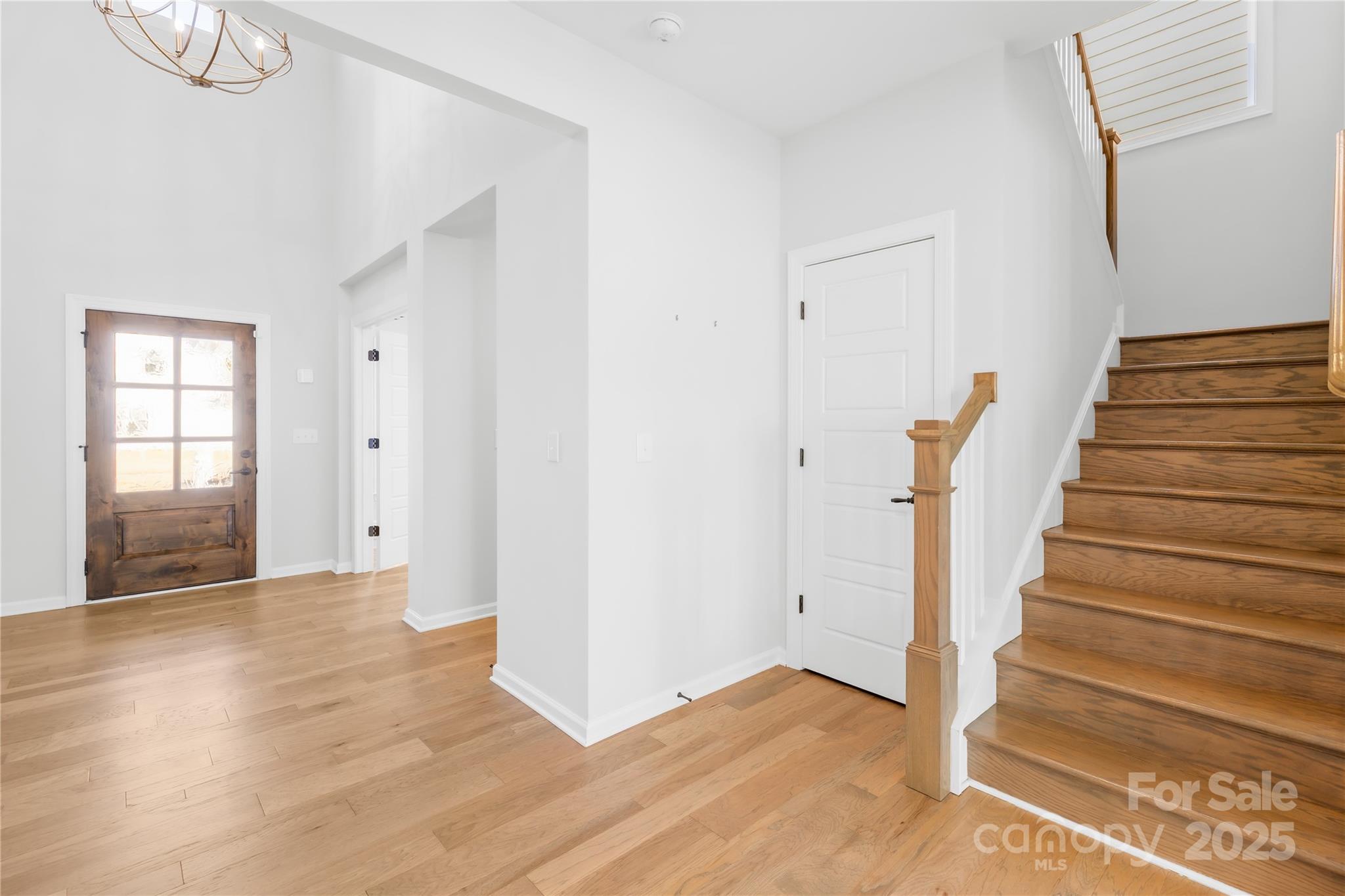 8005 Rolling Wheels Road Charlotte, NC 28215 - Photo 5 of 40 a view of an entryway with wooden floor