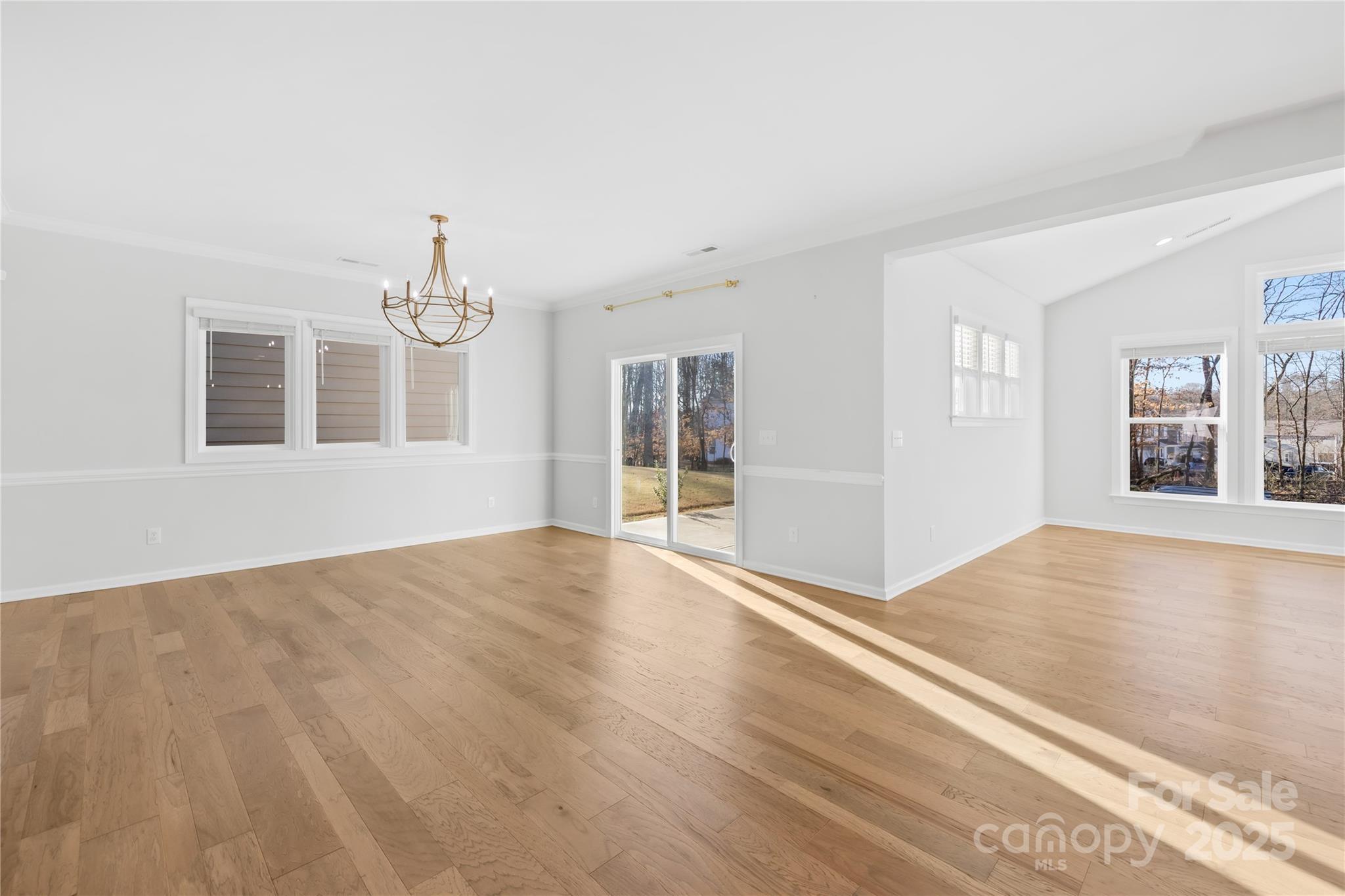 8005 Rolling Wheels Road Charlotte, NC 28215 - Photo 8 of 40 a view of an empty room with a window