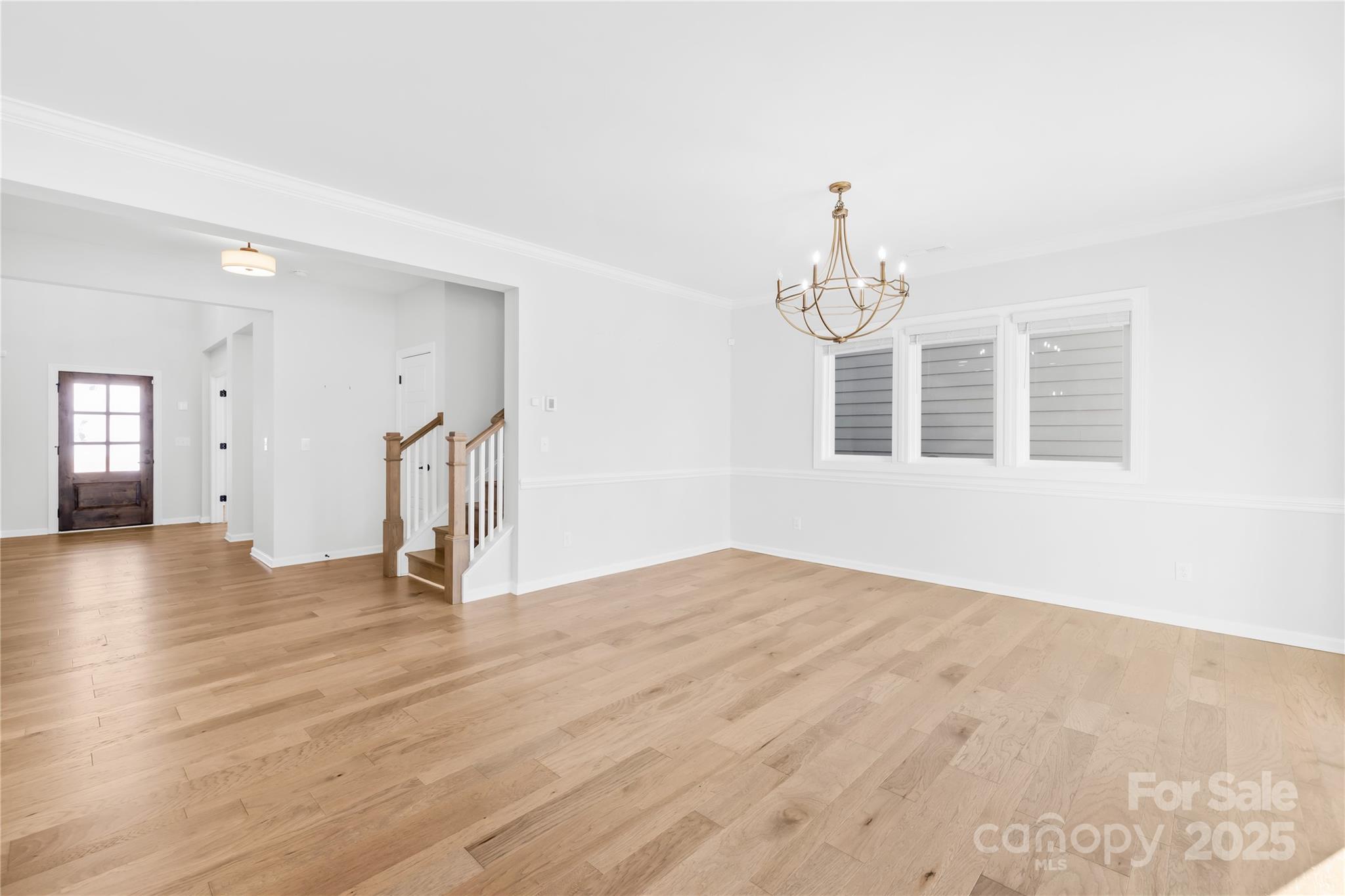 8005 Rolling Wheels Road Charlotte, NC 28215 - Photo 10 of 40 a view of empty room with wooden floor