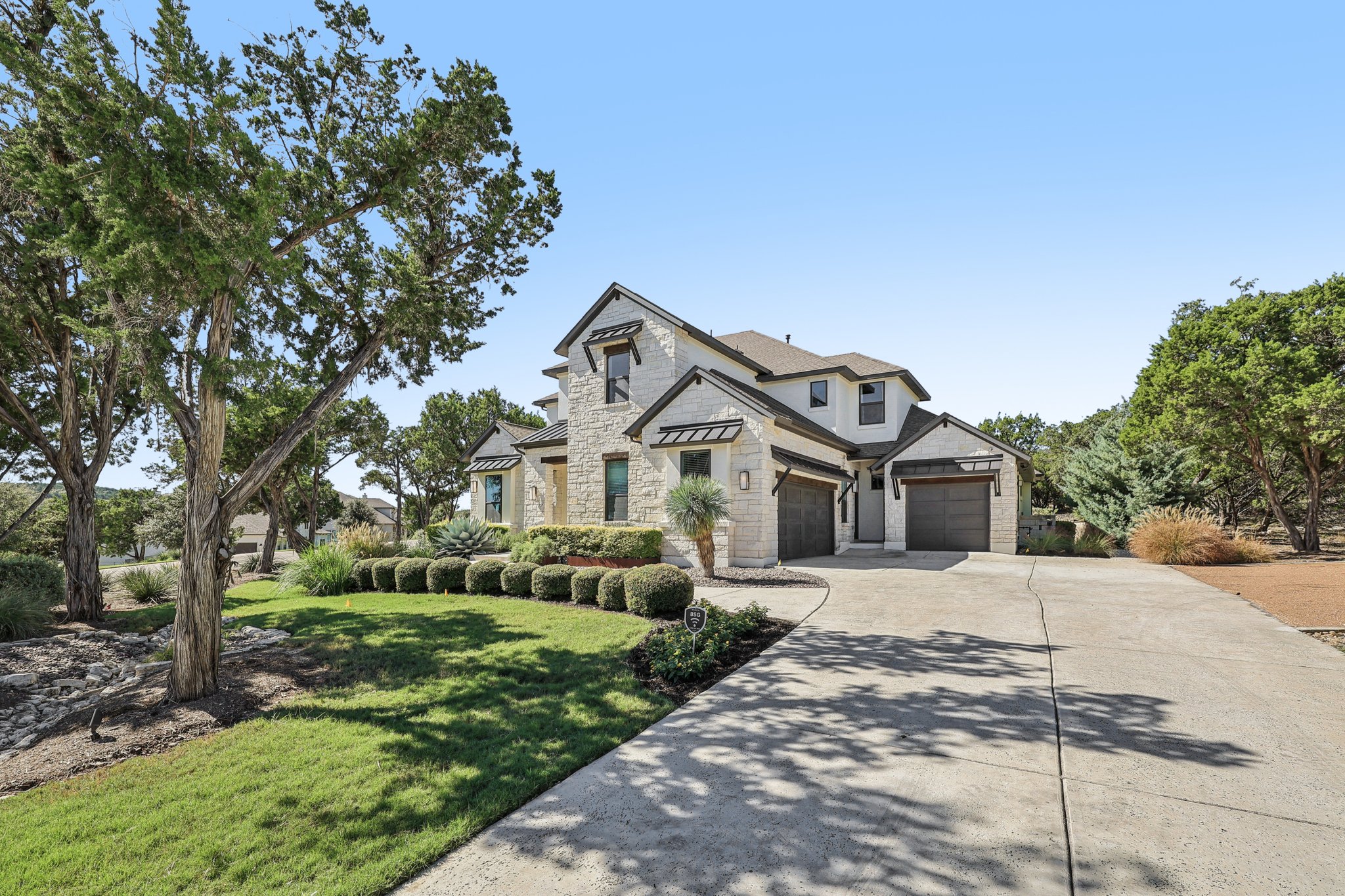19316 Splendor Court Jonestown, TX 78645 - Photo 2 of 40 a front view of a house with a yard